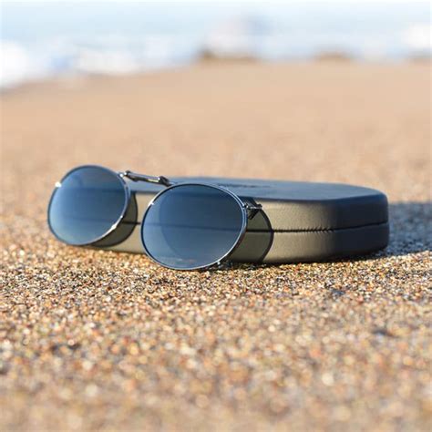 cocoon brand clip on sunglasses.